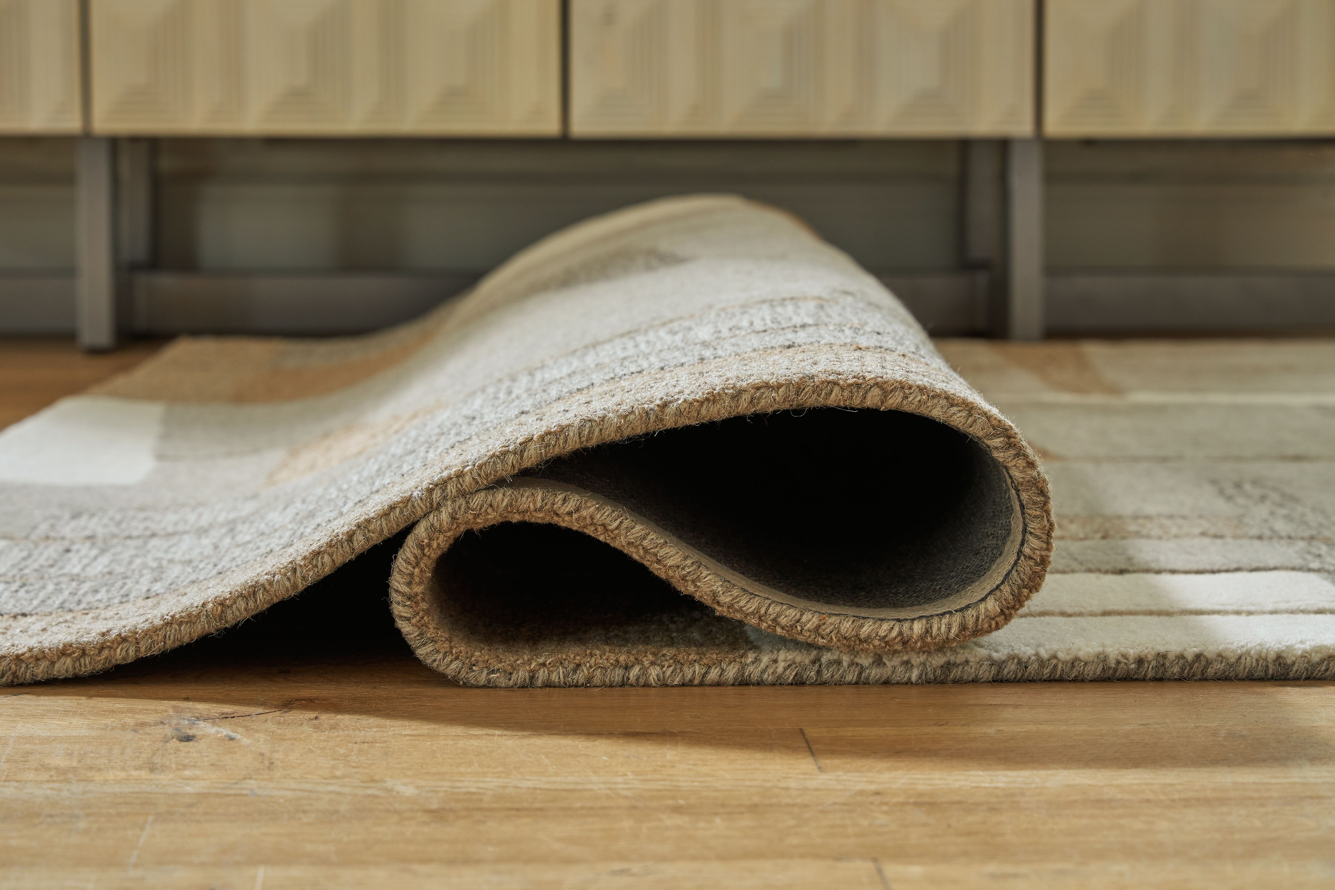 Ashley Furniture Abbotton - 5' x 7' Rug - Taupe / Gray / Caramel - Image 4