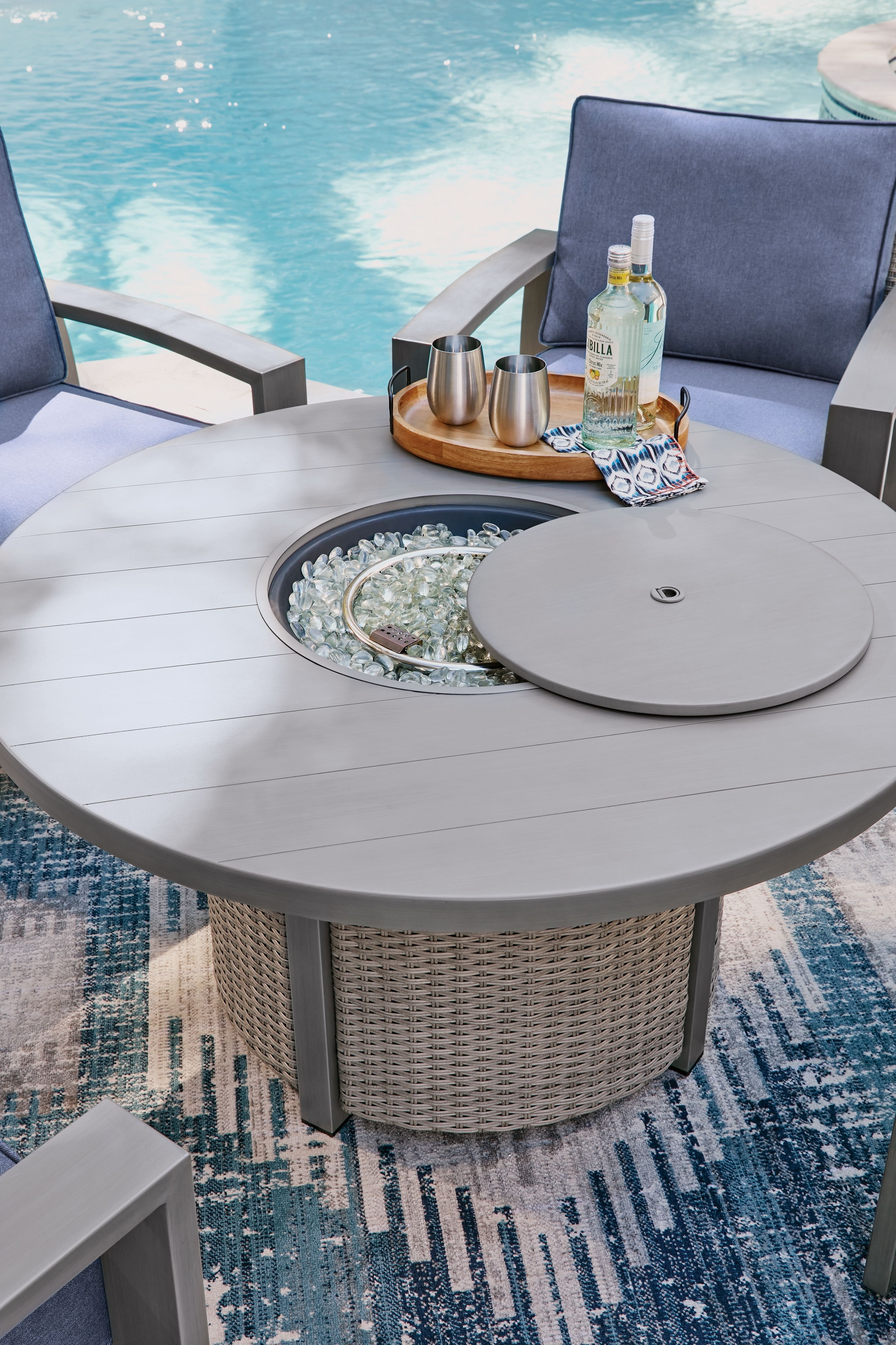 Ashley Furniture Half Moon Beach - Round Fire Pit Table - Gray - Image 6