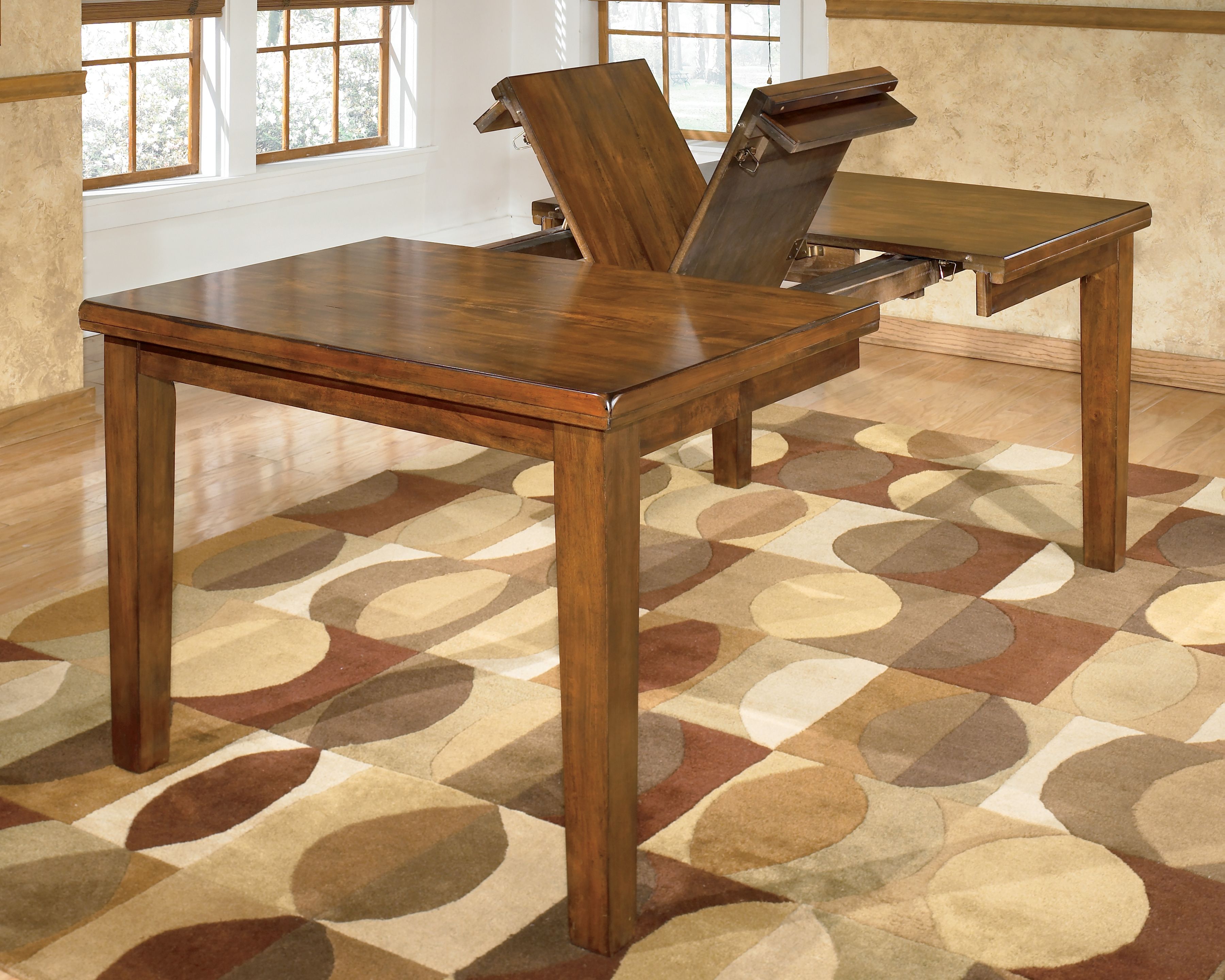 Ralene - Rectangular Dining Room Butterfly Extension Table - Medium Brown