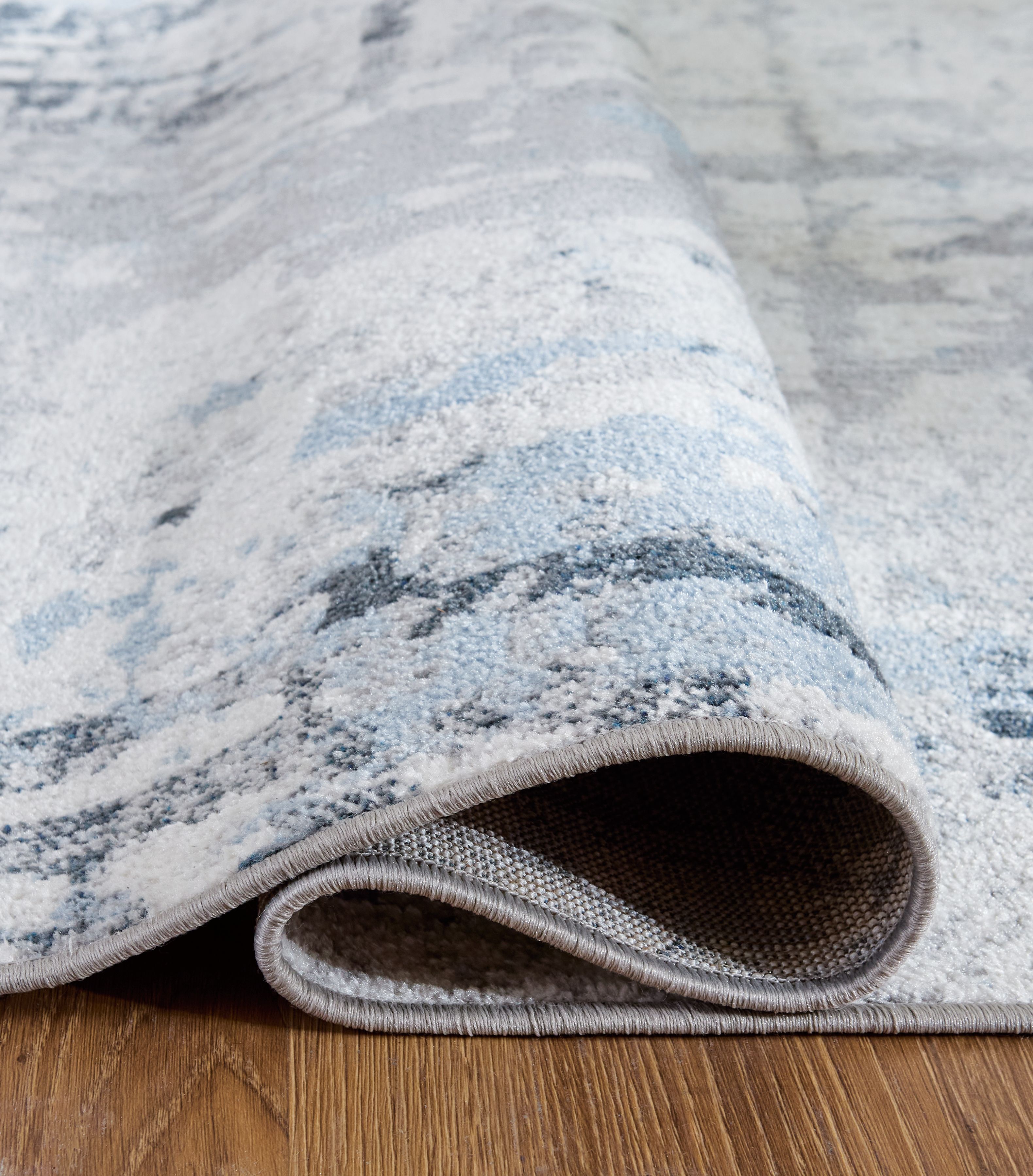 Ashley Furniture Emertonly - 5' x 7' Washable Rug - Blue / White / Gray - Image 4