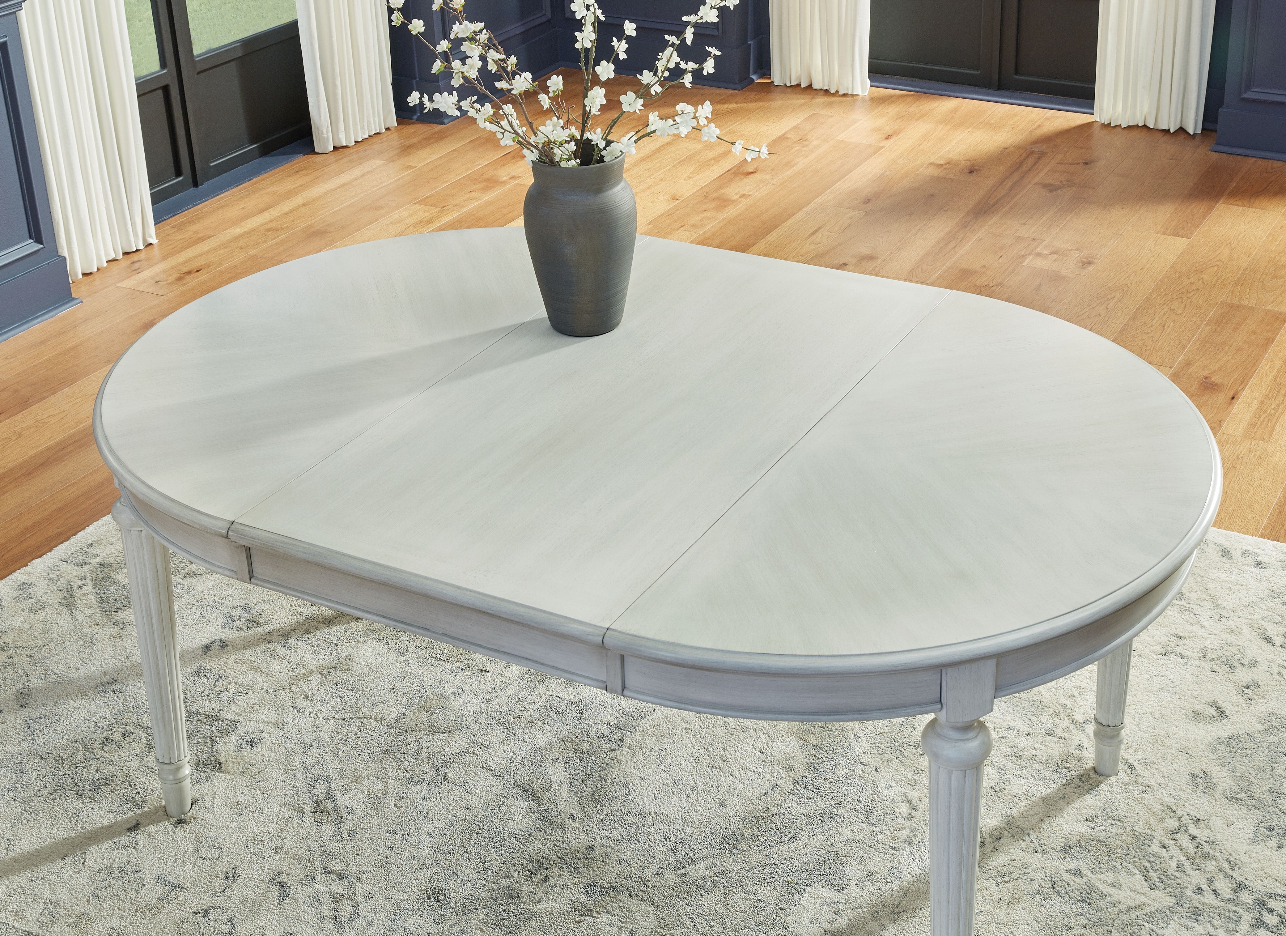 Ashley Furniture Montelaine - Oval Dining Room Extension Table - Antique White - Image 9