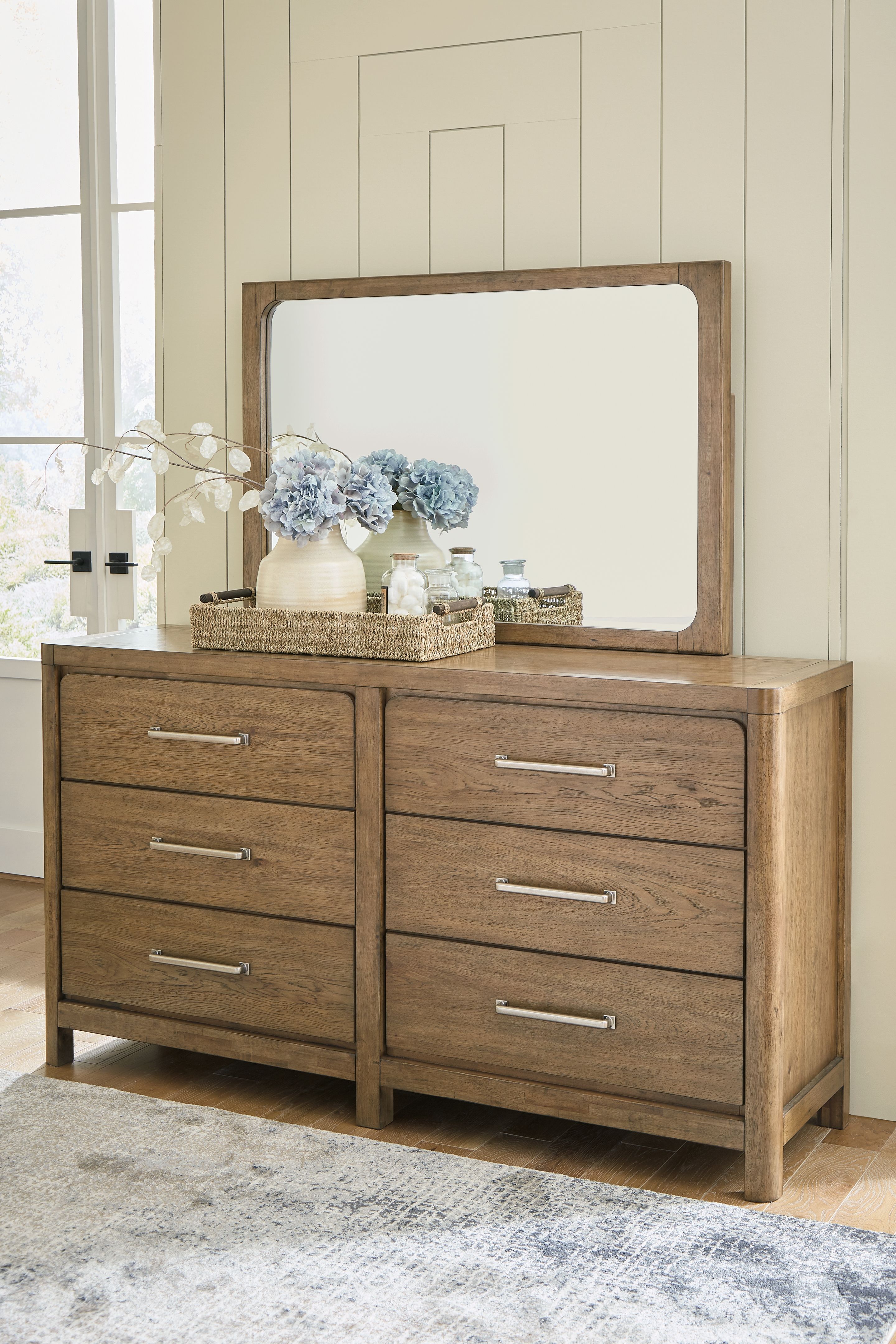 Cabalynn - 7 Pc. - Dresser, Mirror, Chest, California King Upholstered Bed, 2 Nightstands - Light Brown