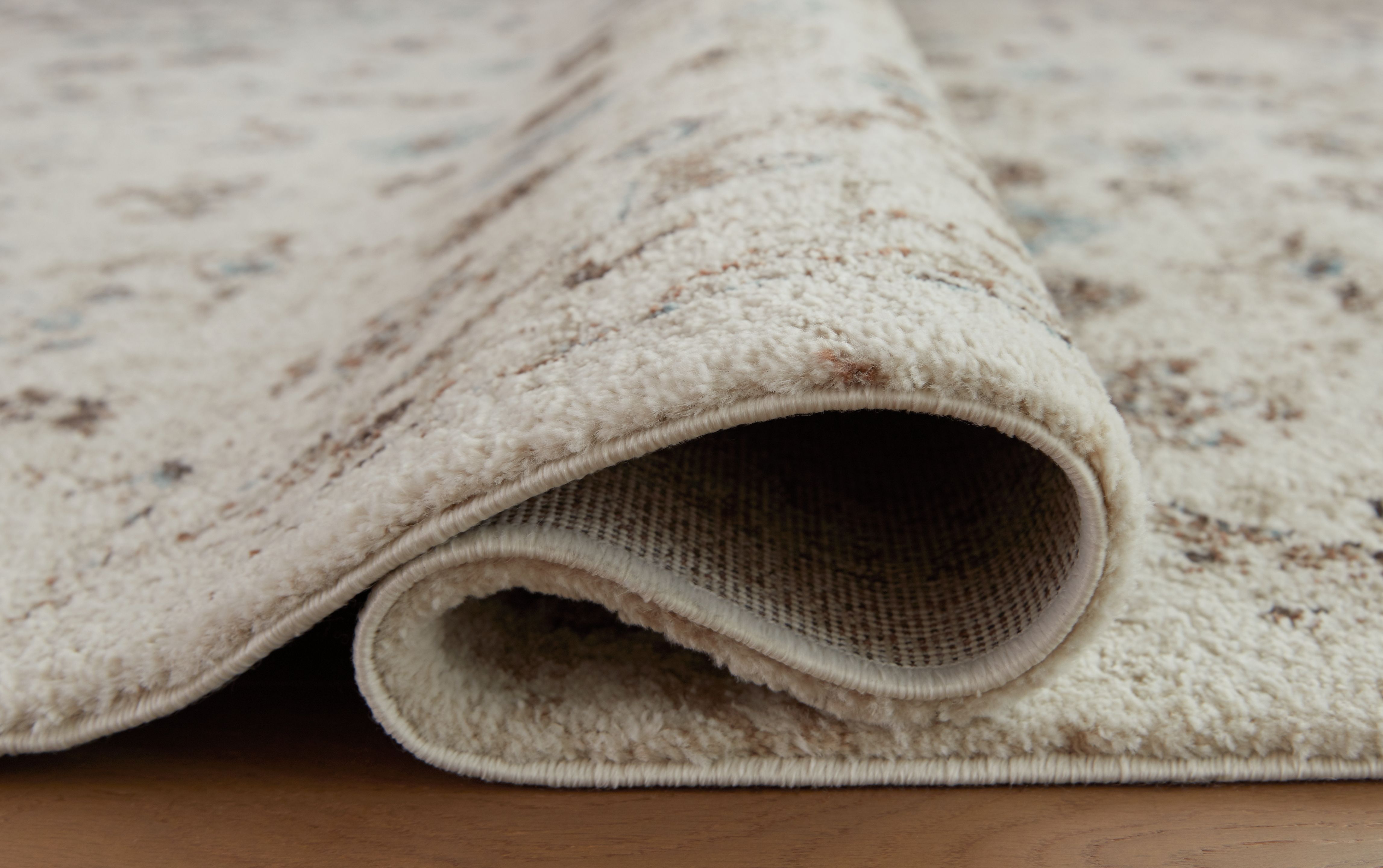 Ashley Furniture Jossler - 5' x 7' Rug - Ivory / Brown / Teal - Image 4