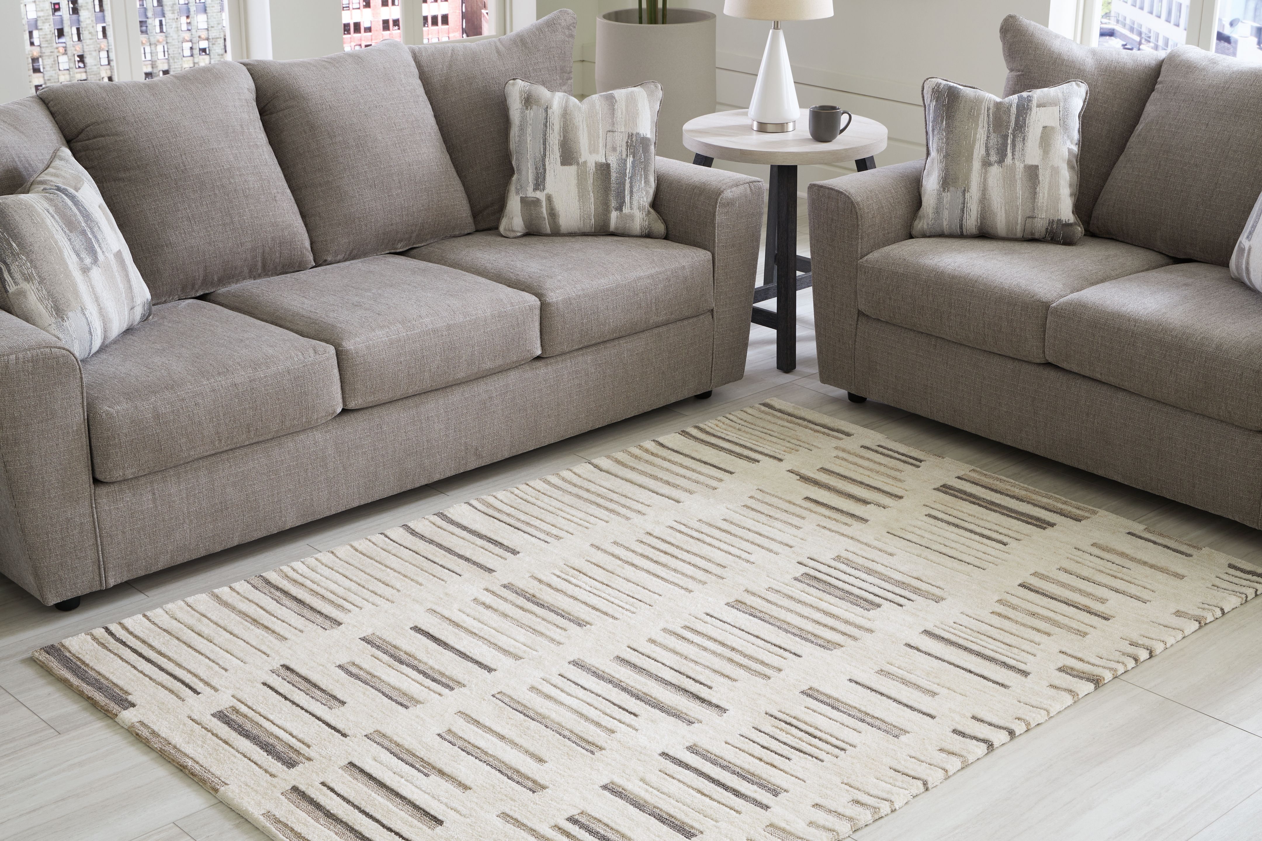 Ashley Furniture Leesdale - 5' x 7' Rug - Ivory / Brown / Black - Image 4