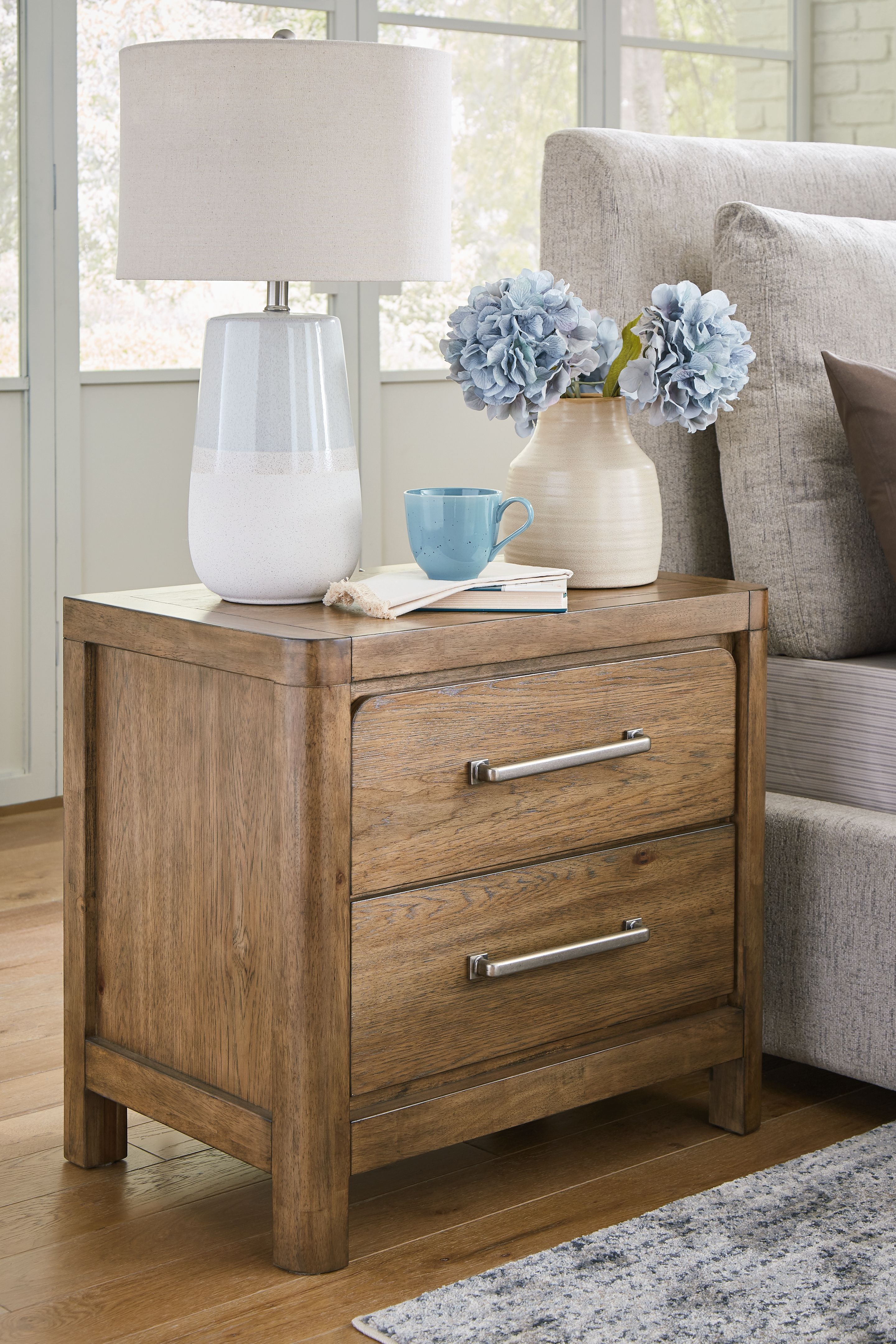 Ashley Furniture Cabalynn - 6 Pc. - Dresser, Mirror, Queen Upholstered Bed, 2 Nightstands - Light Brown - Image 10