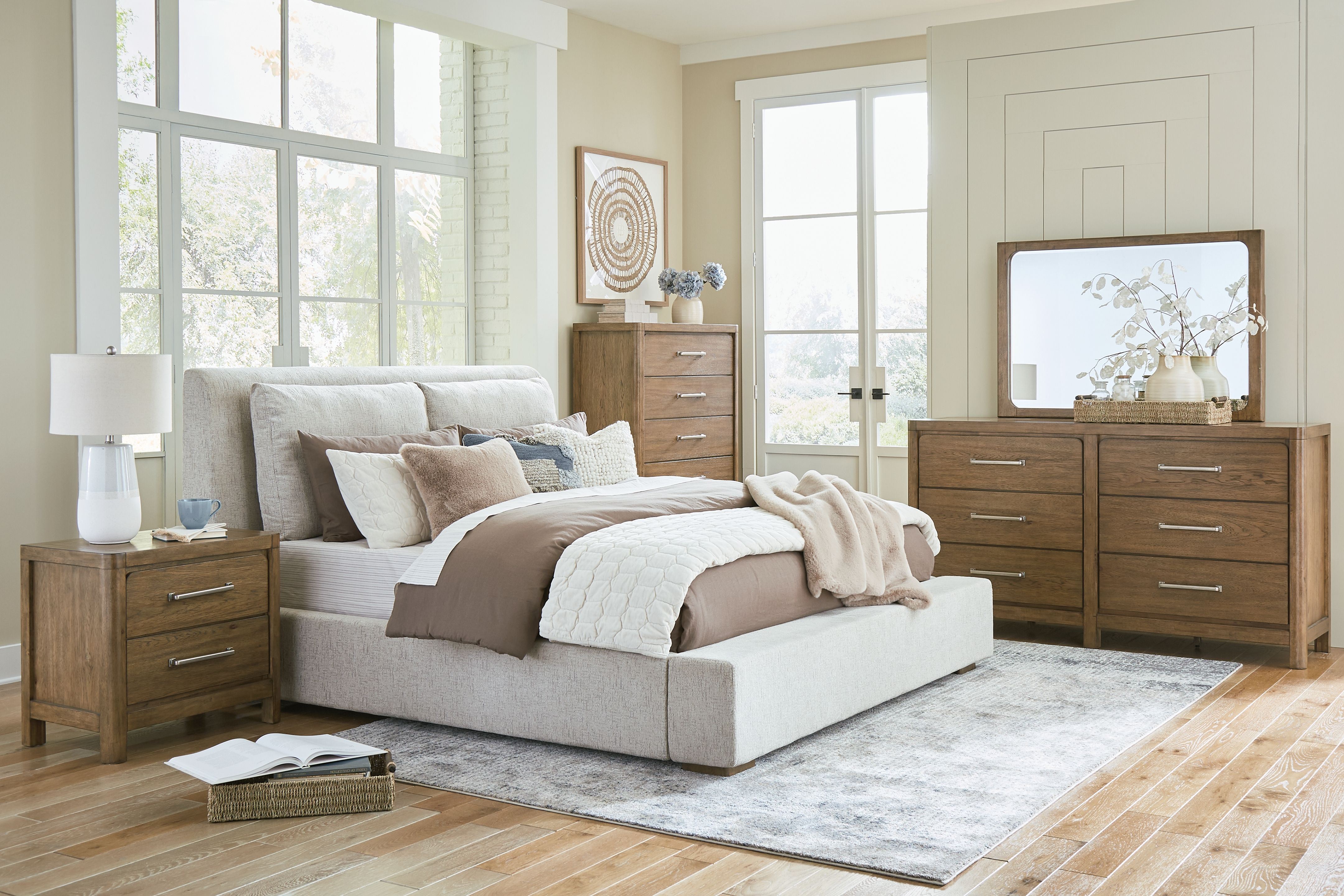 Cabalynn - 7 Pc. - Dresser, Mirror, Chest, California King Upholstered Bed, 2 Nightstands - Light Brown