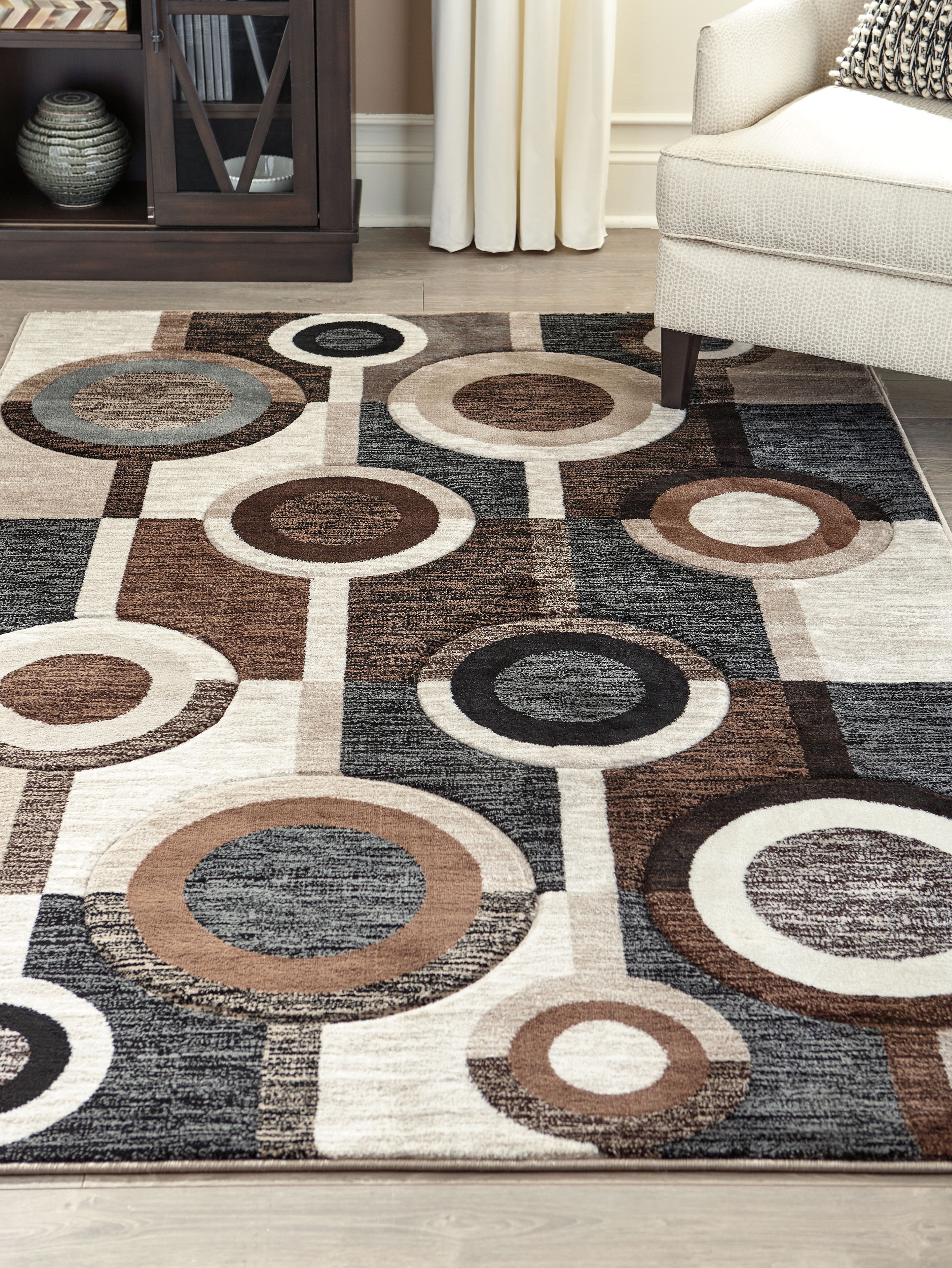 Guintte - 5' x 7' Rug - Brown