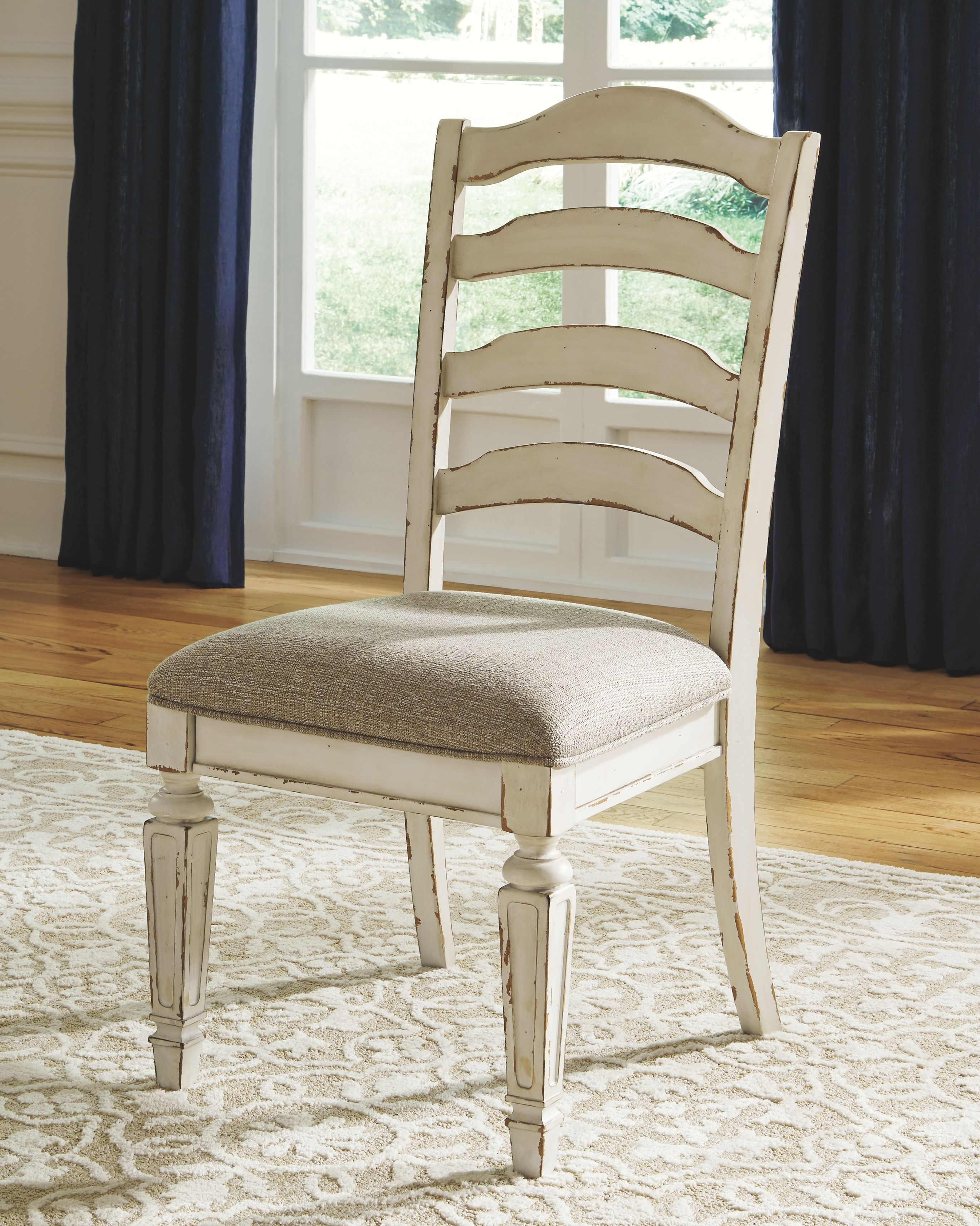 Realyn - 10 Pc. - Extension Table, 8 Ladderback Side Chairs, Server - White
